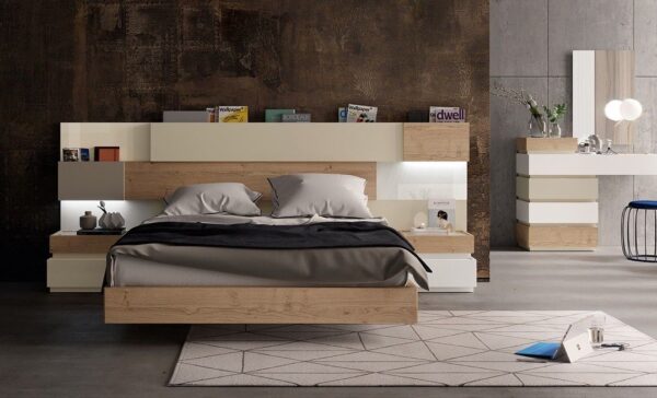 Dormitorio de matrimonio actual con un cabecero con huecos para meter libros,aro de cama y dos mesillas combinado en madera y lacado